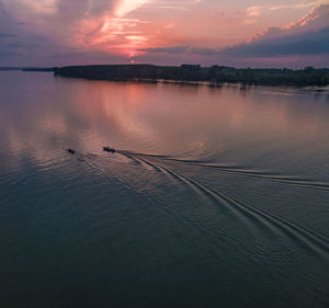 Scenic view of lake against sky during sunset