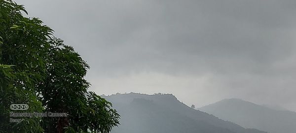 Scenic view of mountains against sky during winter