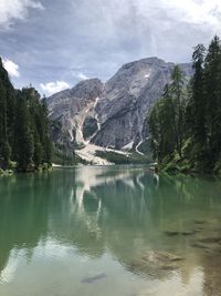 Scenic view of lake and mountains against sky at pragser wildsee