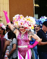 Woman holding multi colored flowers