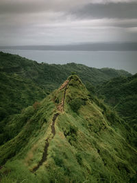 Scenic view of landscape and sea against sky