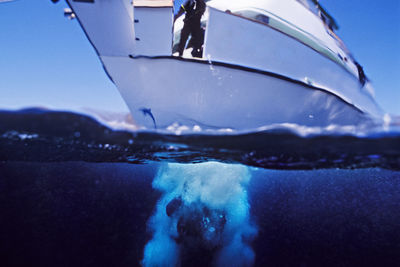 Diver enters the water from the bow of the conception, truth aquatics