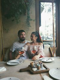 Friends sitting on table