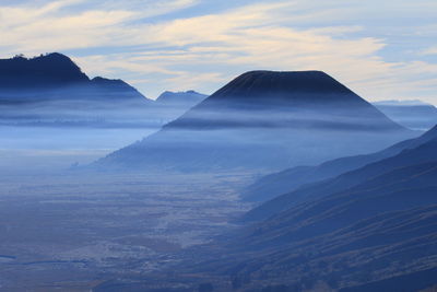 Foggy morning of mount batok covering with blue haze