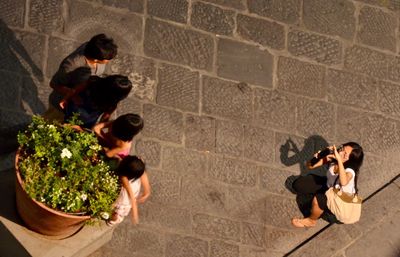 High angle view of people standing on floor