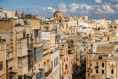 Buildings in city against sky