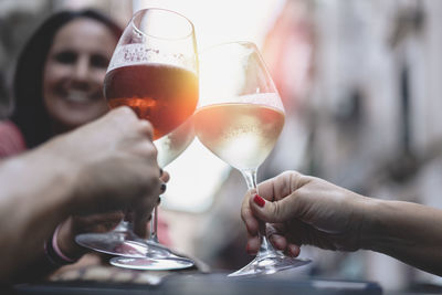 Midsection of man holding drink