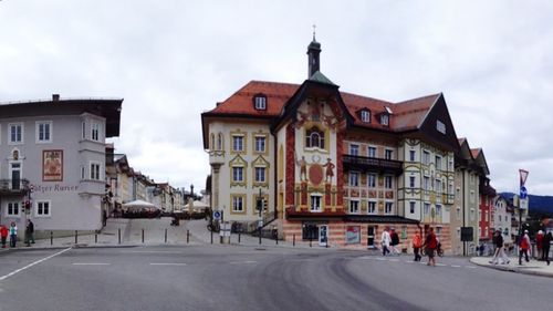 Buildings in town against sky