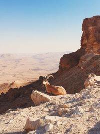 Scenic view of rock formation against clear sky