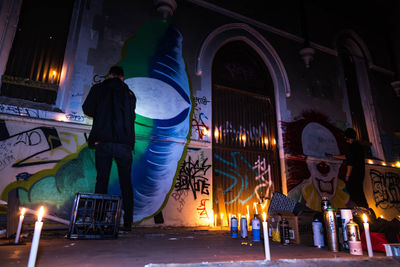 Full length of woman standing at night