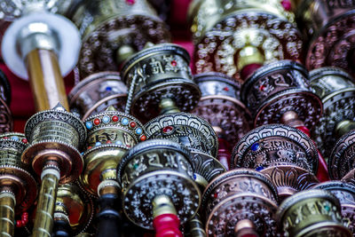 Close-up view of prayer wheels of tibetan buddhism