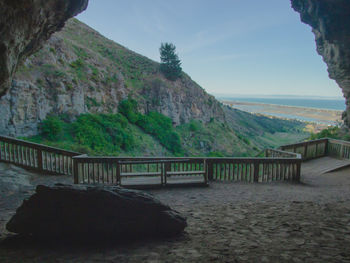 Scenic view of mountains and bridge against sky