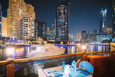 Illuminated buildings in city at night