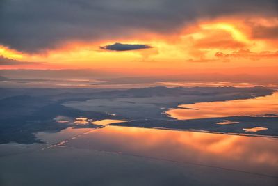 Great salt lake sunset aerial view from airplane wasatch rocky mountain range, utah, united states.