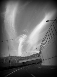 Road passing through dramatic sky