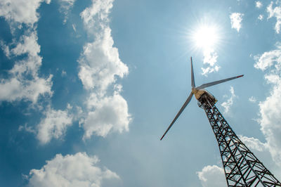 Low angle view of windmill against sky