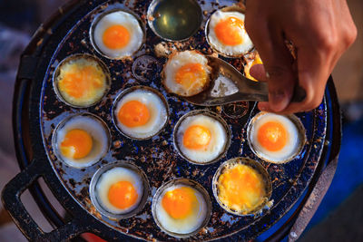 High angle view of man preparing food