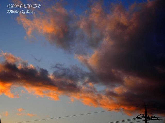 sky, sunset, cloud - sky, low angle view, cloudy, orange color, beauty in nature, dramatic sky, scenics, power line, weather, tranquility, nature, silhouette, cloud, tranquil scene, electricity pylon, overcast, power supply, dusk