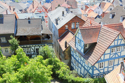 High angle view of houses and trees in town