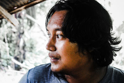 Portrait of young man looking away