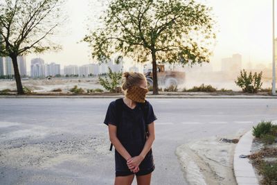 Rear view of woman looking at city