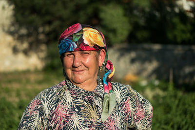 Portrait of man wearing multi colored standing outdoors