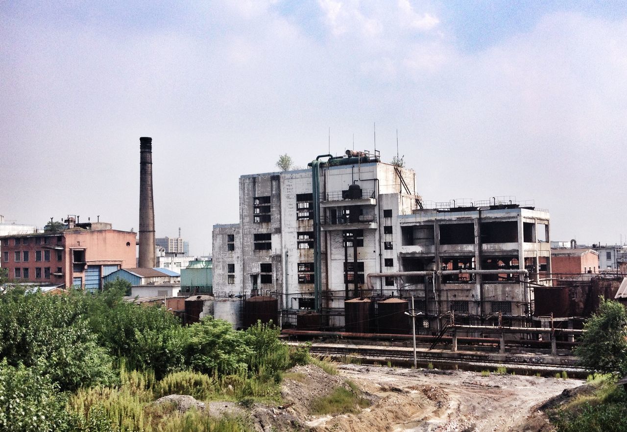 building exterior, architecture, built structure, sky, residential building, building, residential structure, city, tree, house, day, clear sky, low angle view, no people, development, outdoors, blue, residential district, construction site, exterior