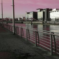 Empty road with buildings in background