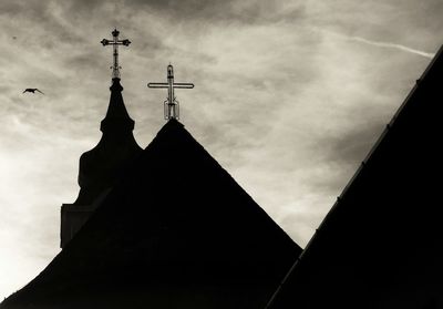 Low angle view of bell tower against sky
