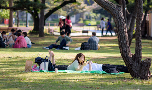 People relaxing in park