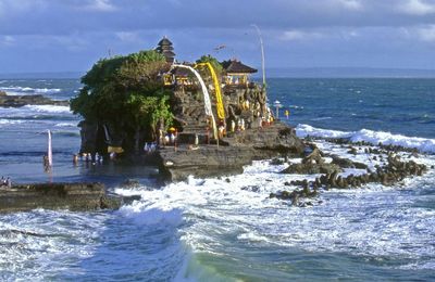 People at tanah lot temple in sea