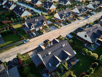 Aerial view of family houses in suburban neighborhood, residential buildings in small town