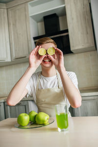 Young woman holding apple