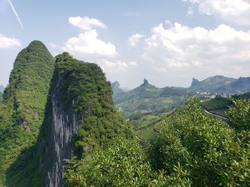 Panoramic view of trees and mountains against sky