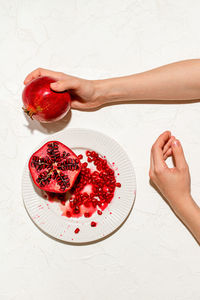 Cropped hands of woman holding food