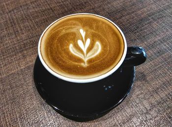 High angle view of cappuccino on table