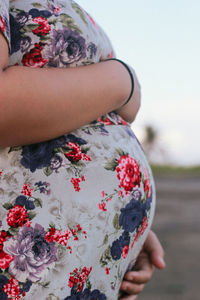 A pregnant woman holding her pregnant belly