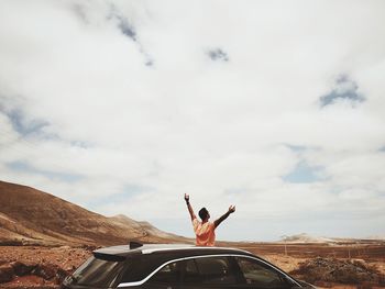 People on the road against sky