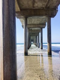 Pier over sea against sky