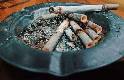 Close-up of cigarette in container