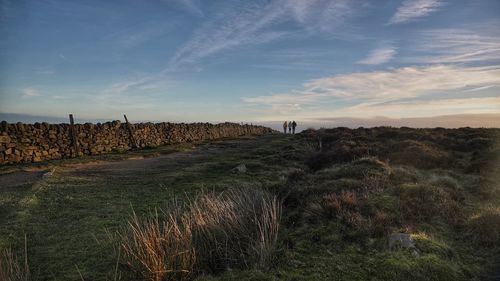 Scenic view of land against sky during sunset