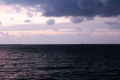 Scenic view of sea against dramatic sky