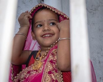 Girl kid cute facial expression in marriage ceremony dress from unique low angle shot in details