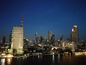 Illuminated buildings in city at night