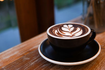 Close-up of cappuccino on table