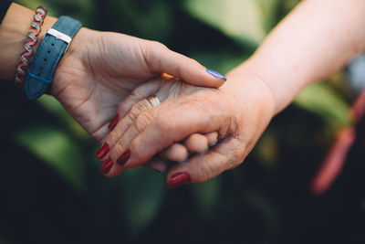 Close-up of hand holding hands