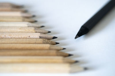 High angle view of pencils on white table