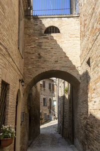 View of alley amidst buildings