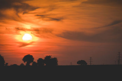 Scenic view of silhouette trees against sky during sunset