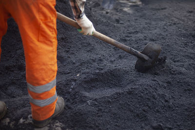 Low section of man working at construction site